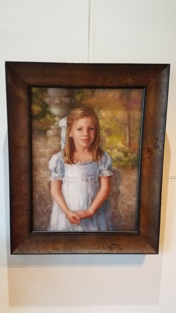 "Little Girl in a Garden" by Laura Lewis 