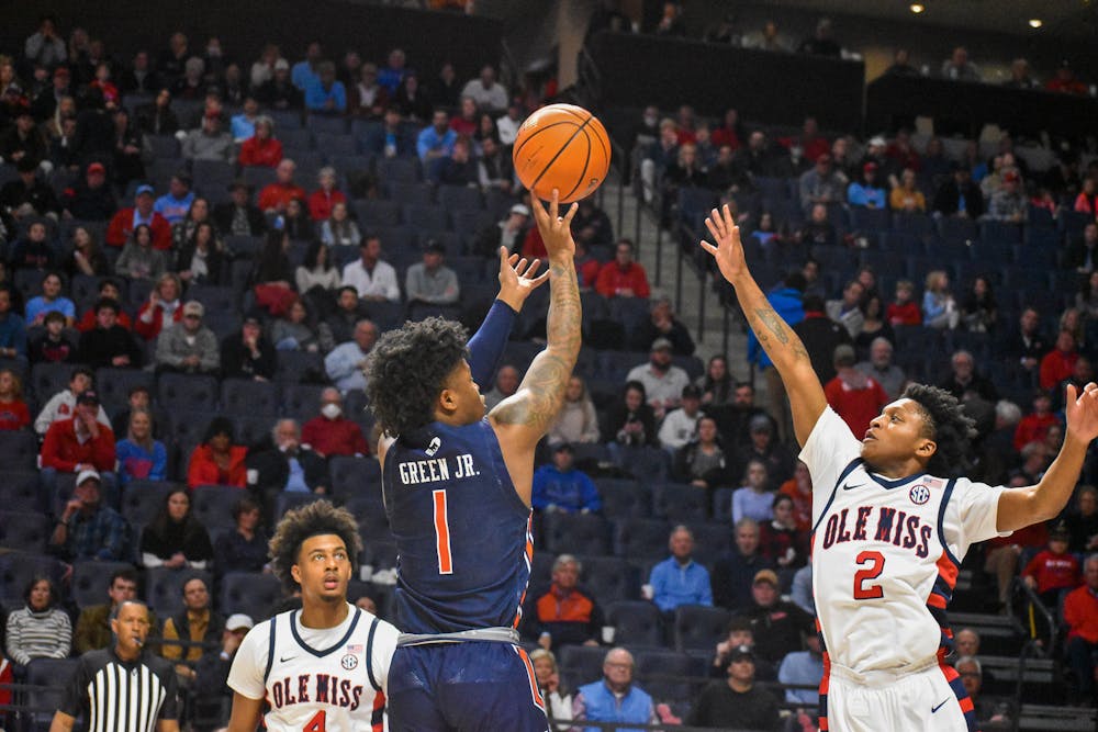<p>January 15, 2022; Oxford, Mississippi; Wendell Green Jr. (1) rises up for a jumper during a match between Auburn and Ole Miss in the Sandy and John Black Pavilion.&nbsp;</p>