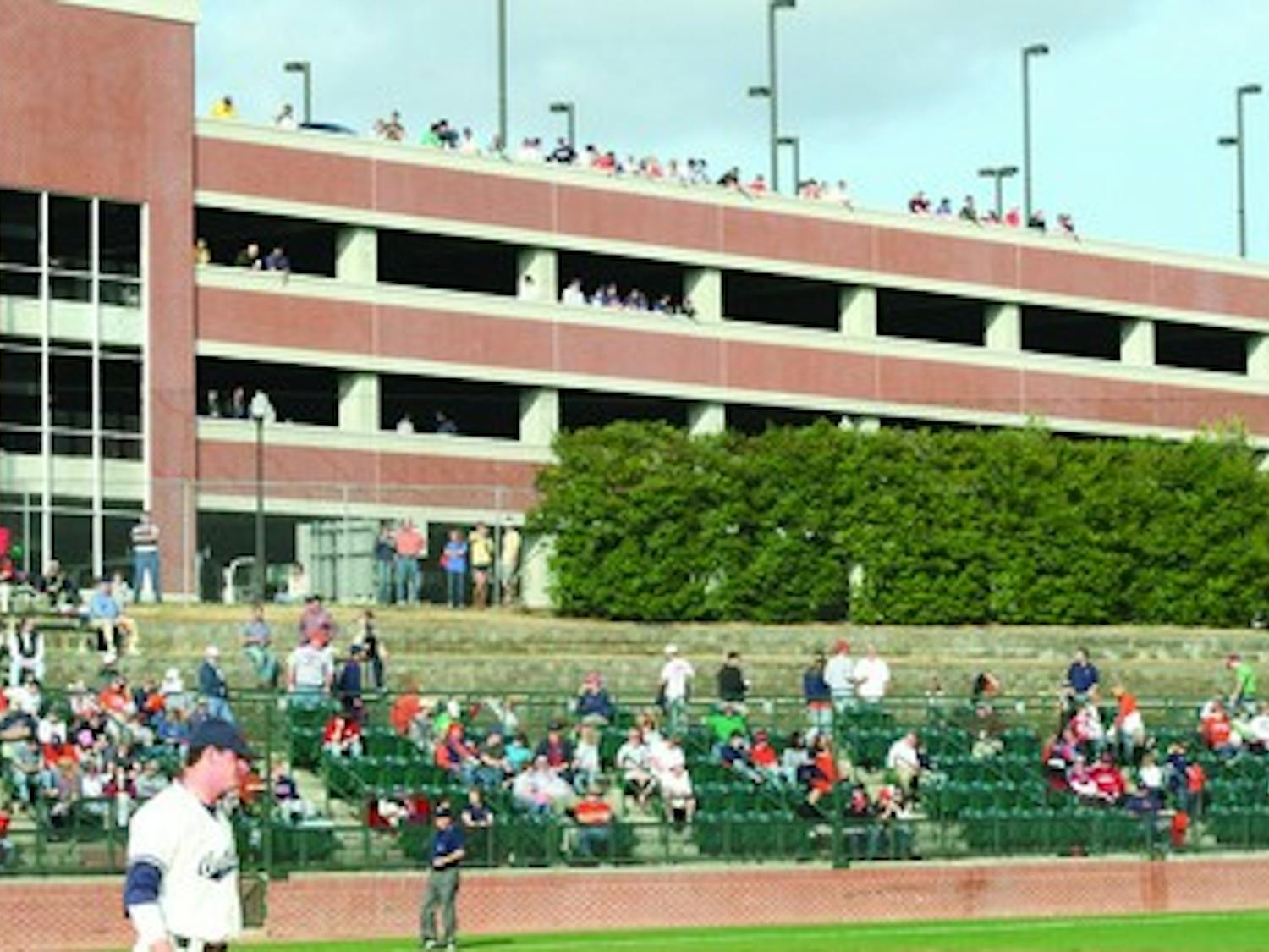 Numerous fans take in last week's baseball series against the Florida State Seminole from the parking deck between Plainsman Park and Jordan-Hare Stadium. The fans pictured had various opinions on why the location was better than purchased seats.