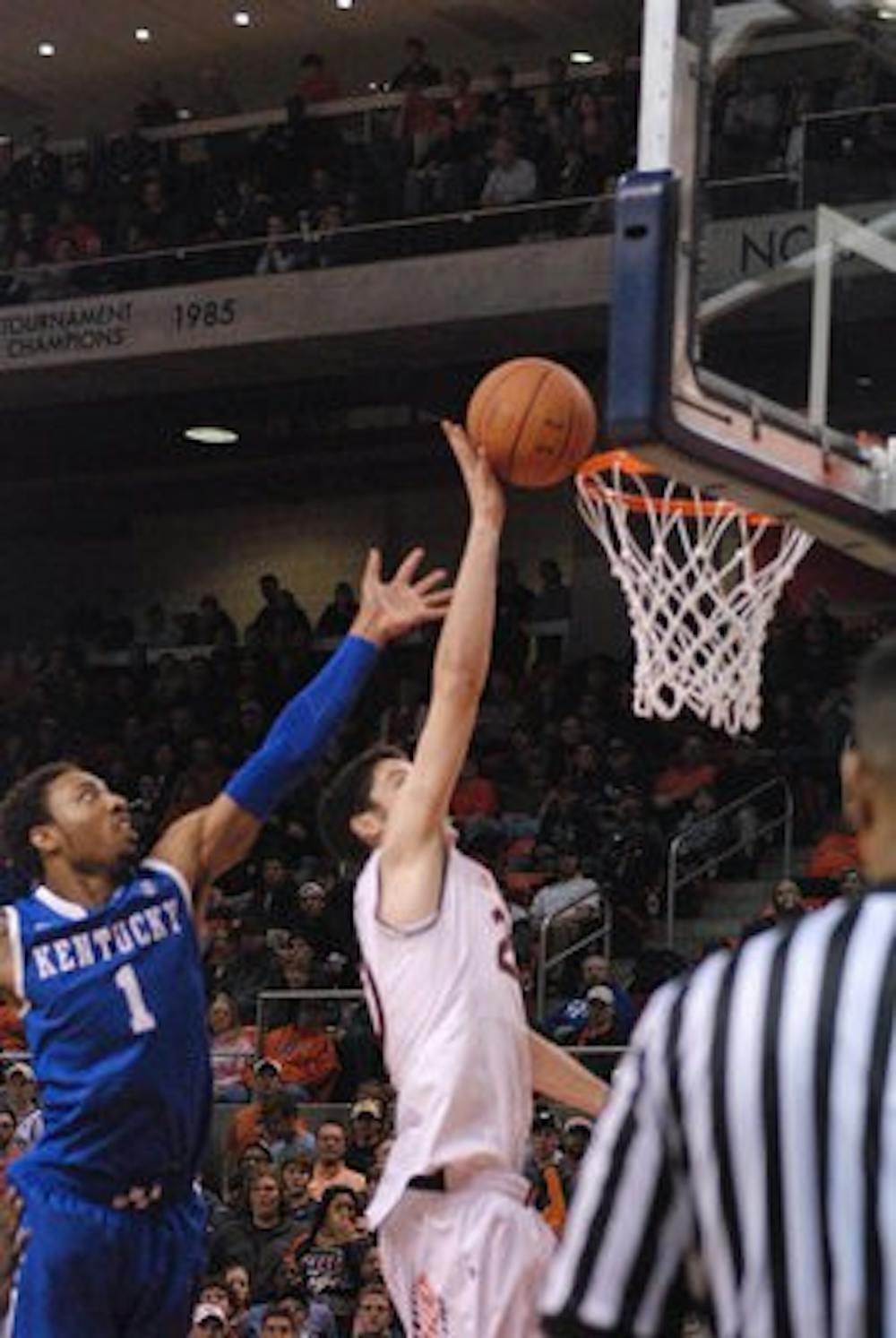 Alex Thompson goes for a layup against Kentucky's James Young, Feb. 12, 2014 in Auburn Arena. (Emily Enfinger / STAFF PHOTOGRAPHER)