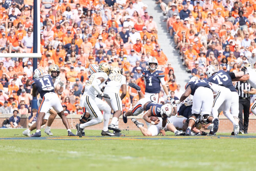 Auburn Football player gets tackled down against Vanderbilt on Nov. 2, 2024.