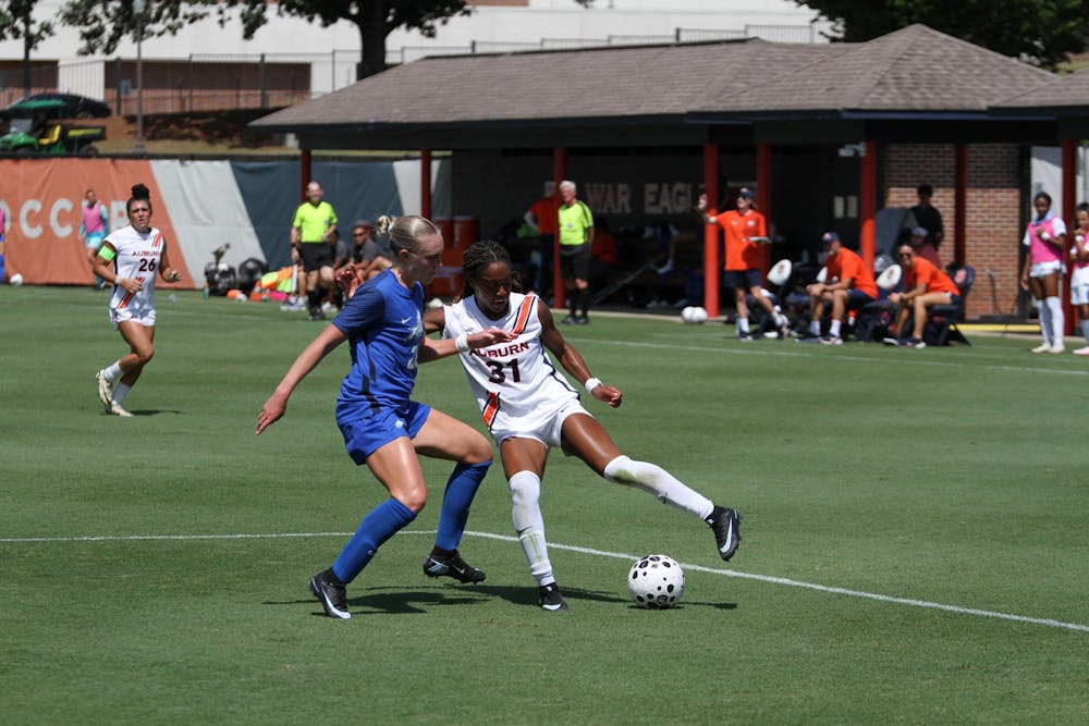 While playing within the box Jordyn Crosby (31) attempts to keep the ball safe against the FGCU defender on Jane B. Moore Field during the Auburn University Women's Soccer game against FGCU on Sunday, Sept. 7, 2025.