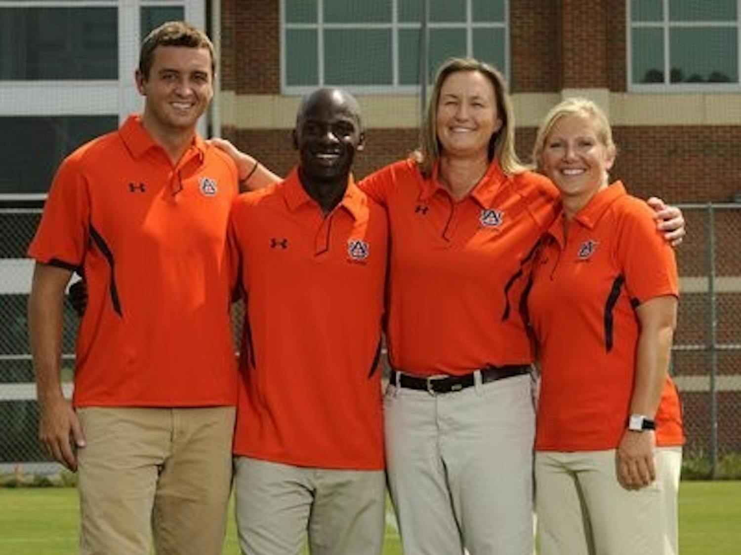 McAlpine stands with the other coaches of the Auburn women's soccer team. (Todd Van Emst / Media Relations)