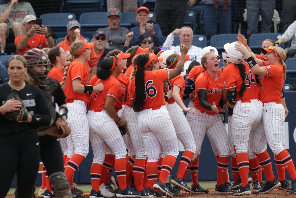 <p>Amelia Lech (#34) celebrates homerun with teammates against Virginia Tech at Jane B. Moore Field on February 9th 2024.</p>