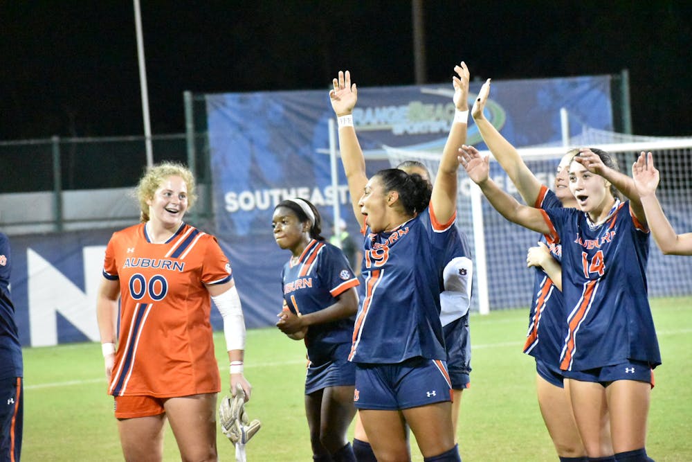 <p>Nov. 2, 2021; Orange Beach, Alabama; Auburn celebrates with fans after defeating South Carolina in the second round of the SEC Tournament.</p>