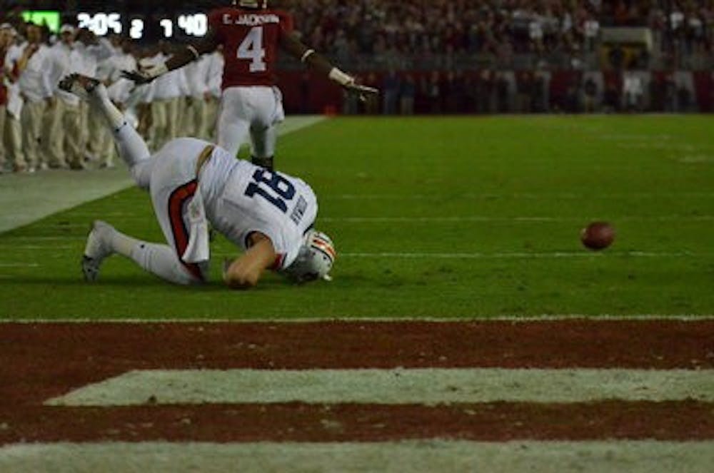 CJ Uzomah is unable to come up with a pass against Alabama. (Raye May / Photo Editor)