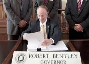 Gov. Robert Bentley signs into law the immigration bill known as H.B. 56. (Courtesy of the Governor's office)