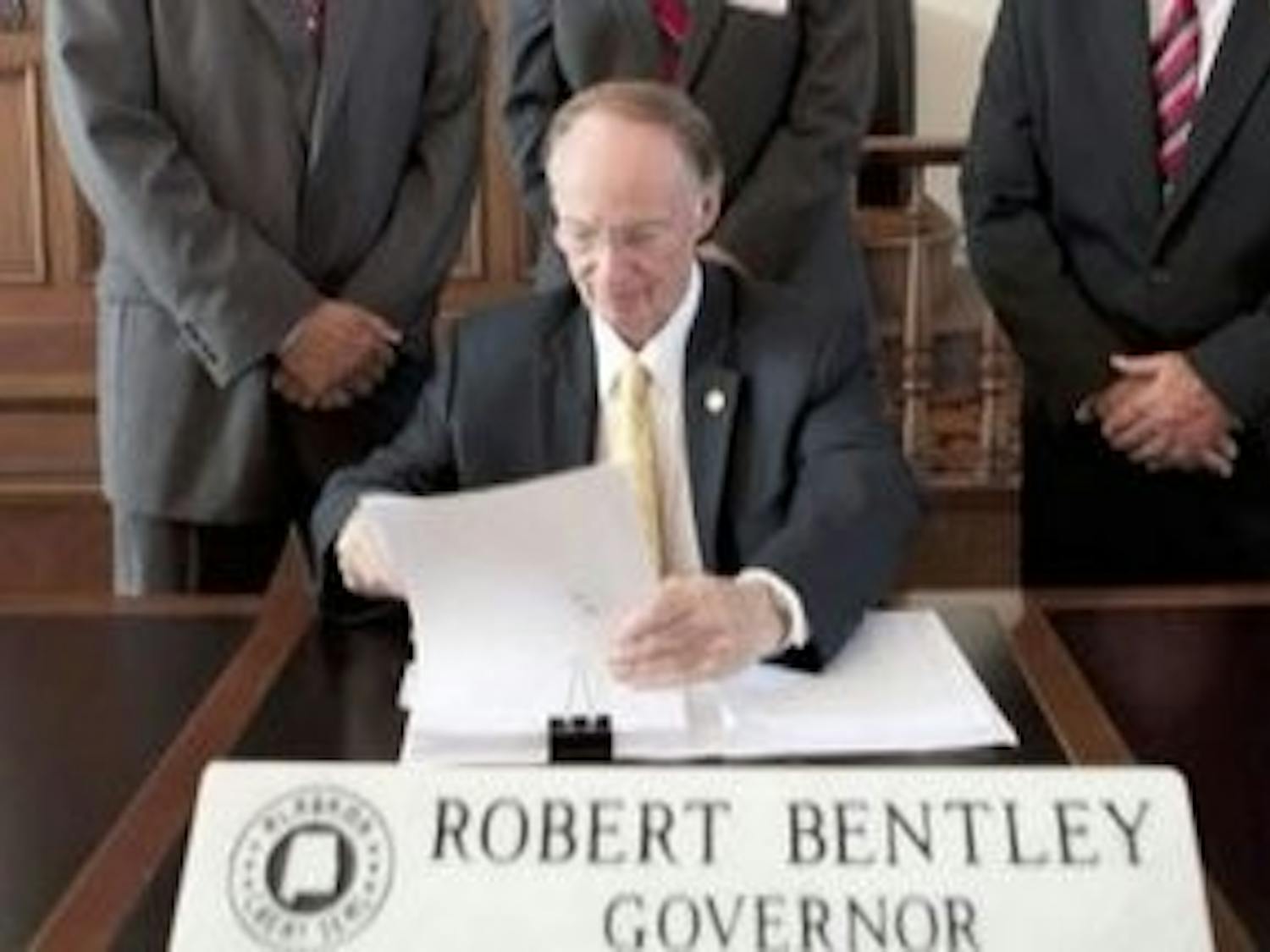Gov. Robert Bentley signs into law the immigration bill known as H.B. 56. (Courtesy of the Governor's office)