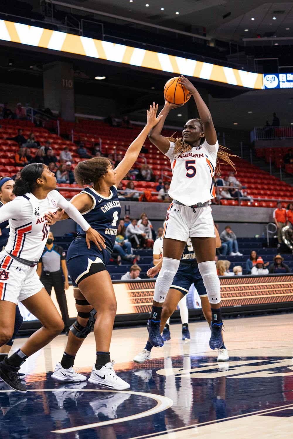 <p>Nov. 26, 2021; Aicha Coulibaly (5) shoots the ball during a game against Charleston Southern from Auburn Arena in Auburn, Ala.</p>