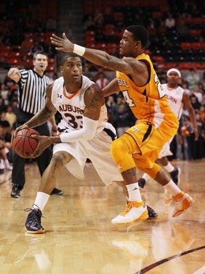 Sophomore guard Earnest Ross looks to shoot past Tennessee guard Josh Bone during Auburn's 69-56 loss Feb. 3 (Emily Adams / Photo Editor)