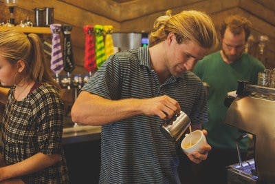 Chandler Roberds, senior in human development and family studies, works at Wake Up Coffee Company. (Kenny Moss | Photographer)