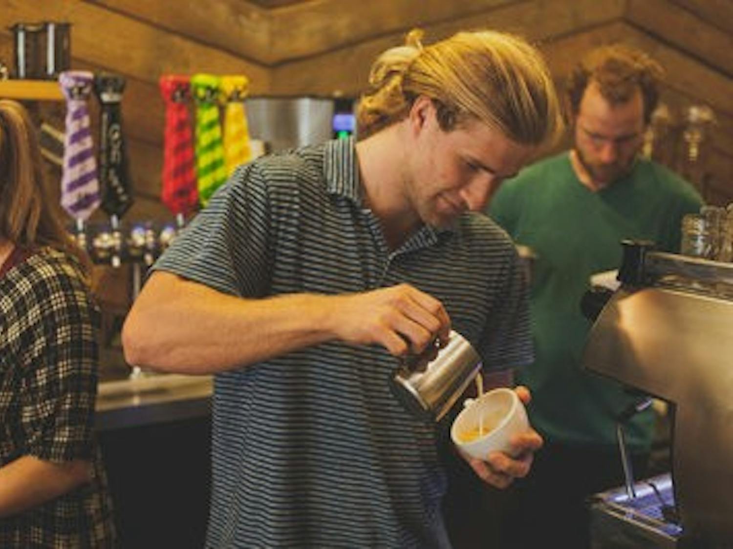 Chandler Roberds, senior in human development and family studies, works at Wake Up Coffee Company. (Kenny Moss | Photographer)