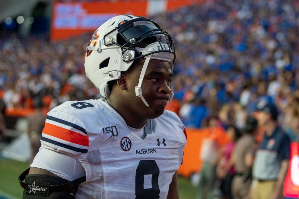 <p>Coynis Miller Jr. (8) walks off the field following Auburn's 13-24 loss to Florida, on Saturday, Oct. 5, 2019, in Gainesville, Fla.</p>