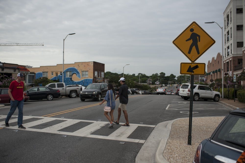 The mid-block crosswalk on North College Street between Magnolia and Tichenor Avenues.