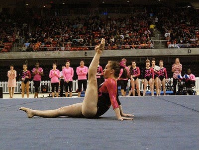 Megan Walker competes on the floor during a home meet earlier this season at Auburn Arena. gymnastics