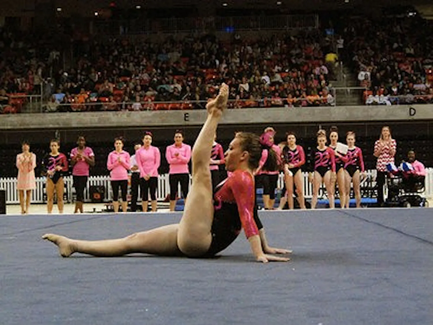 Megan Walker competes on the floor during a home meet earlier this season at Auburn Arena. gymnastics