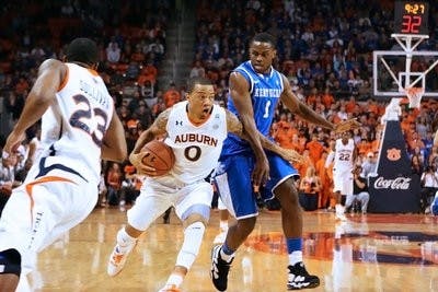 Sophomore forward Josh Langford drives on Kentucky forward Darius Miller during last week's contest against the Wildcats. Langford contributed four points in the 68-53 loss. (Rebecca Croomes / PHOTO EDITOR)