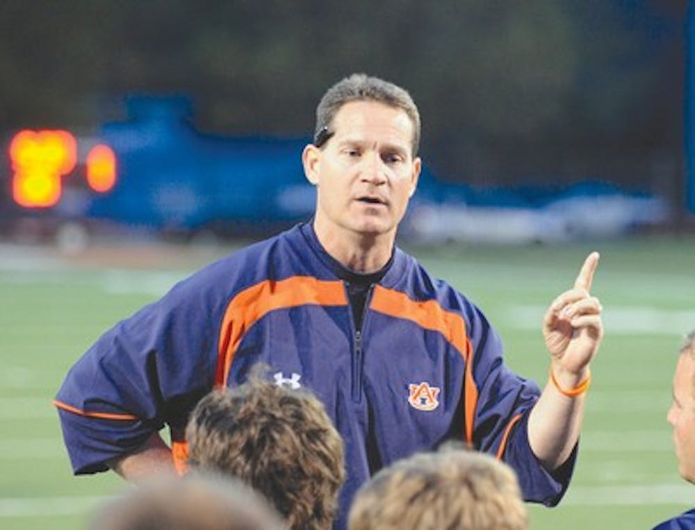 Auburn coach Gene Chizik talks to his players on Tuesday.First day of spring football on Tuesday, March 24, 2009 in Auburn, Ala.Todd Van Emst