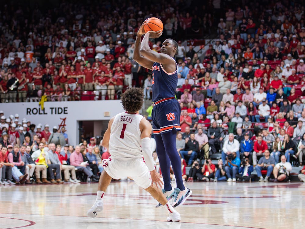 Jaylin Williams rises up for a 3-pointer during the first half of Auburn vs Alabama on January 24, 2024