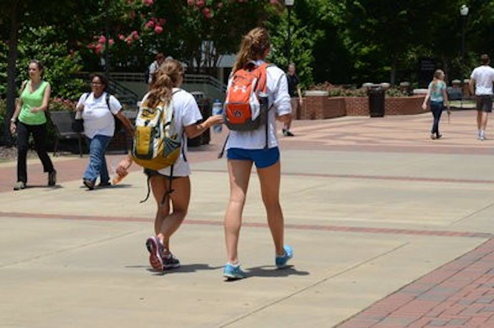Auburn students walk down the Haley concourse in Nike shorts and T-shirts. (Raye May | Photo & Design Editor)