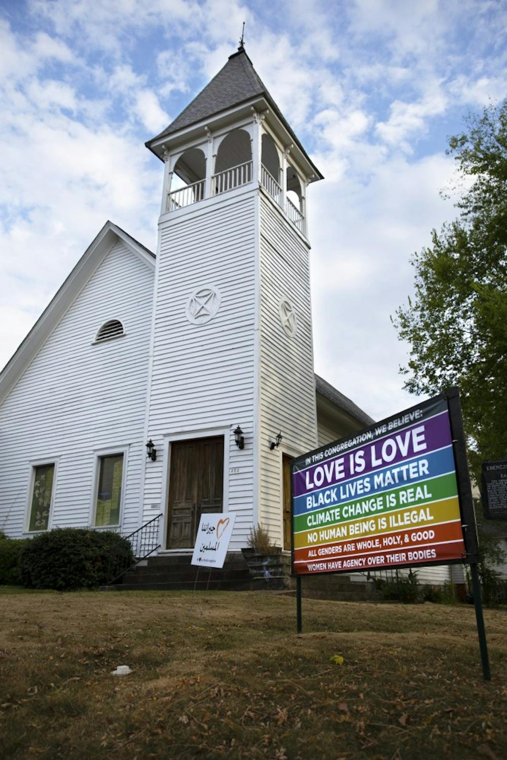 <p>The front of the Auburn Unitarian Universalist Fellowship and the sign that displays some of their beliefs on October 7, 2019.</p>
