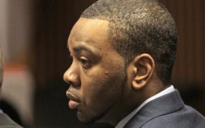 Defendant Courtney Lockhart listens during opening statements Nov. 12, 2010 in his capital murder trial in the Opelika courtroom. (Dave Martin / AP PHOTO)