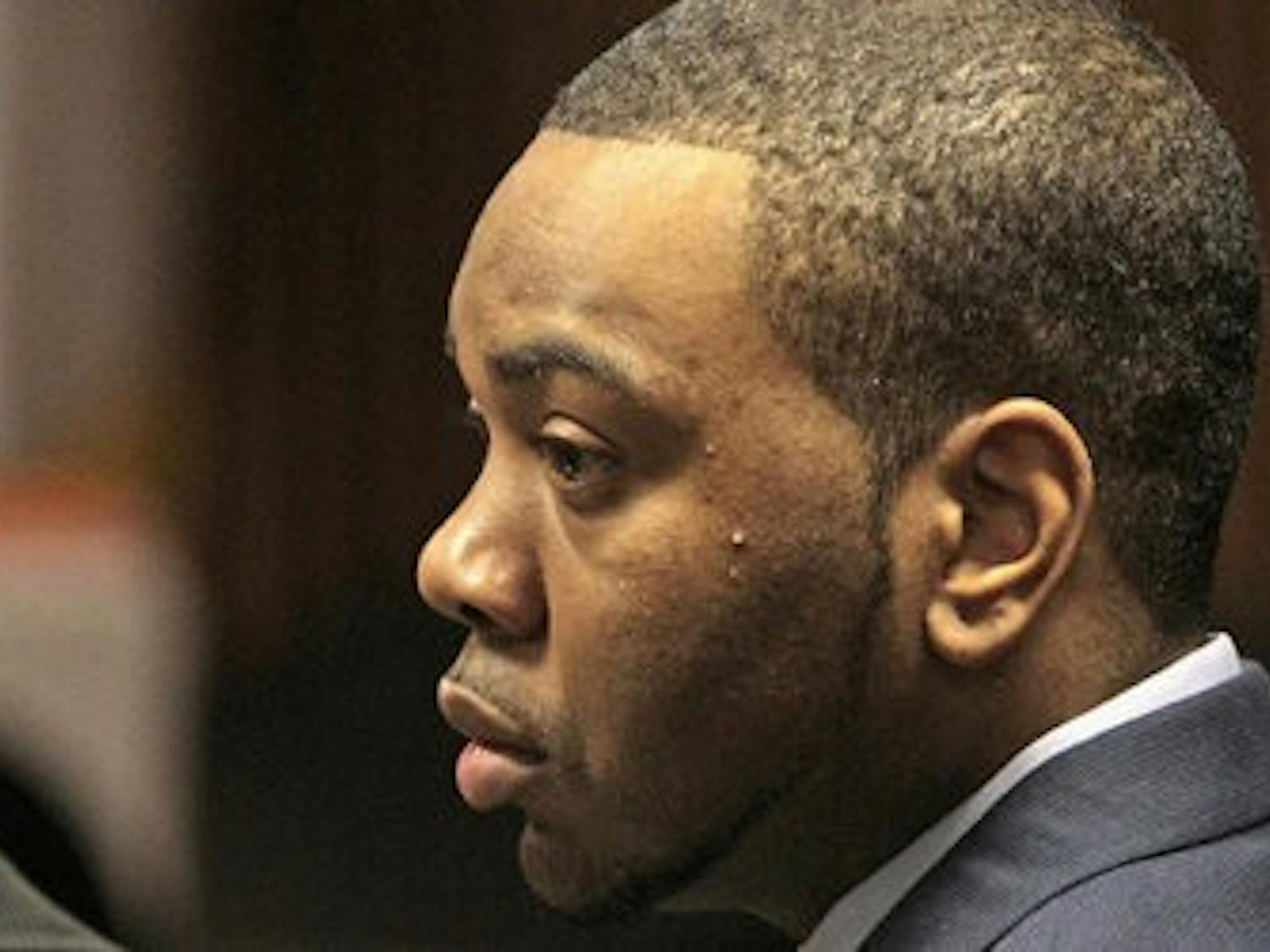 Defendant Courtney Lockhart listens during opening statements Nov. 12, 2010 in his capital murder trial in the Opelika courtroom. (Dave Martin / AP PHOTO)