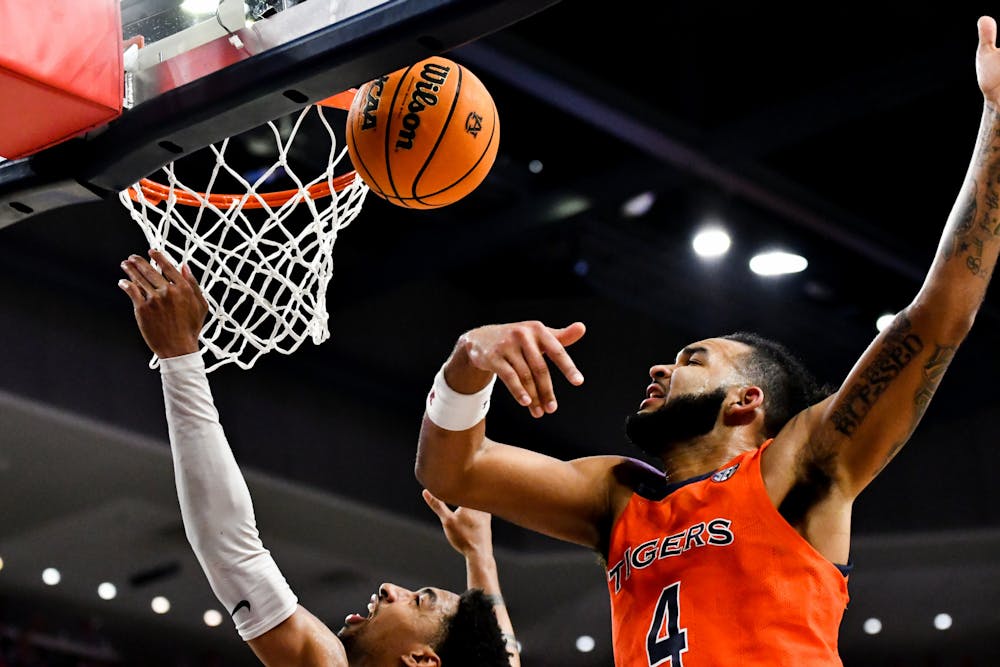 <p>Auburn Men's Basketball Player Johni Broome (4) intercepts the ball from Ole Miss in Neville Arena on Feb. 22, 2023.</p>
