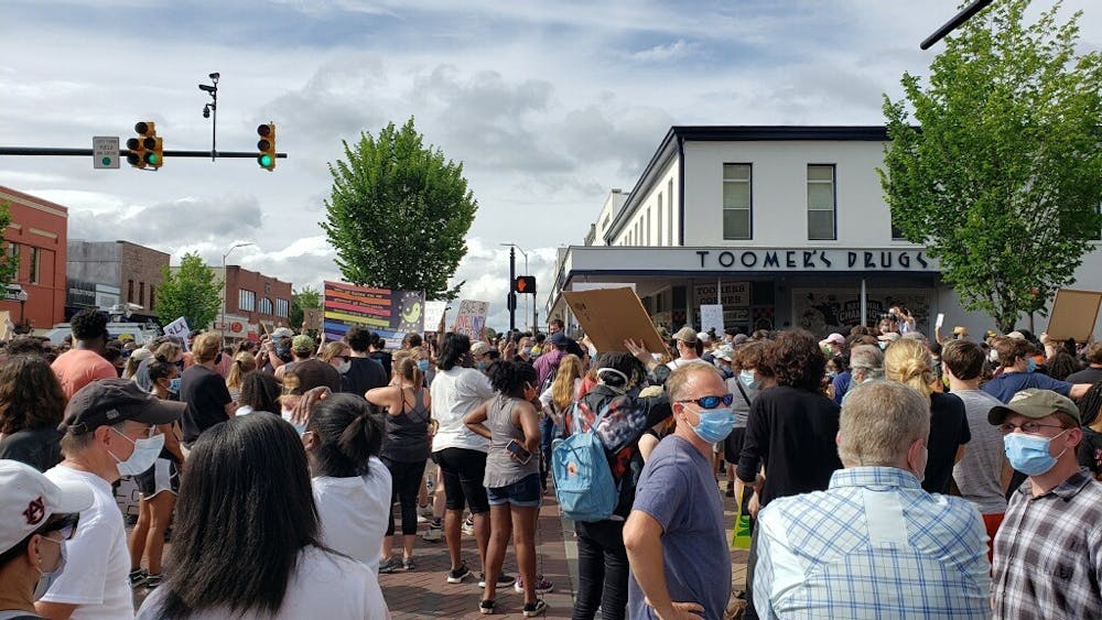 Protestors gather on Toomer's Corner on June 7, 2020, in Auburn, Ala.