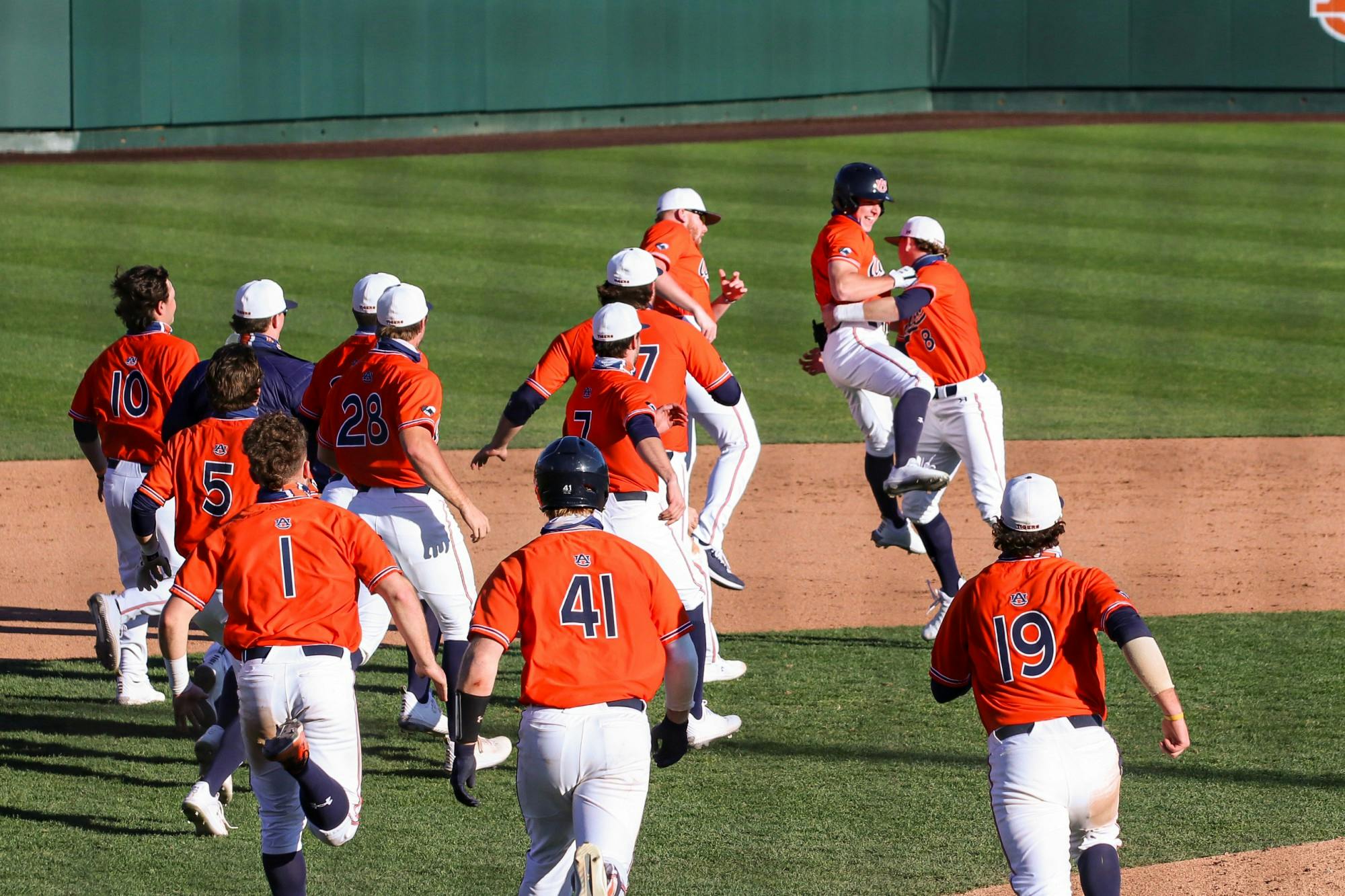 022121_Auburn_IMG_9167_The team reacts after winning run .jpg