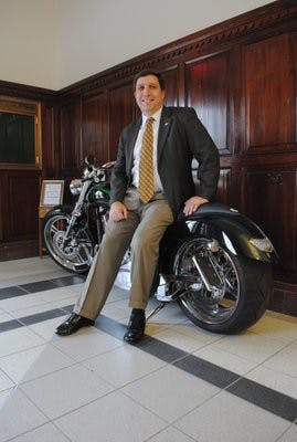 Charlie Duggan, city manager, helped bring The Viper Motorcycle Company to Auburn. A motorcycle sits in City Hall to commemorate the partnership. (Maria Iampietro / Associate Photo Editor)