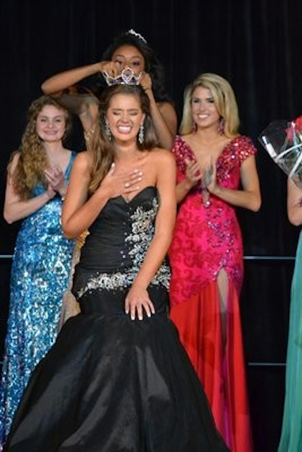 Molly Pinnix, freshman in communication, accepting her title as Delta Sigma Phi's Miss Fall Rush 2013