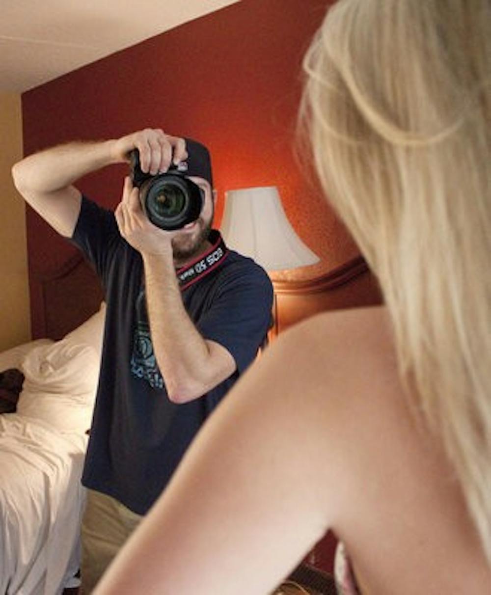 Zachary Johnson, Playboy photographer, shoots an eager coed for "Girls of the SEC." (Emily Adams / Photo Editor)