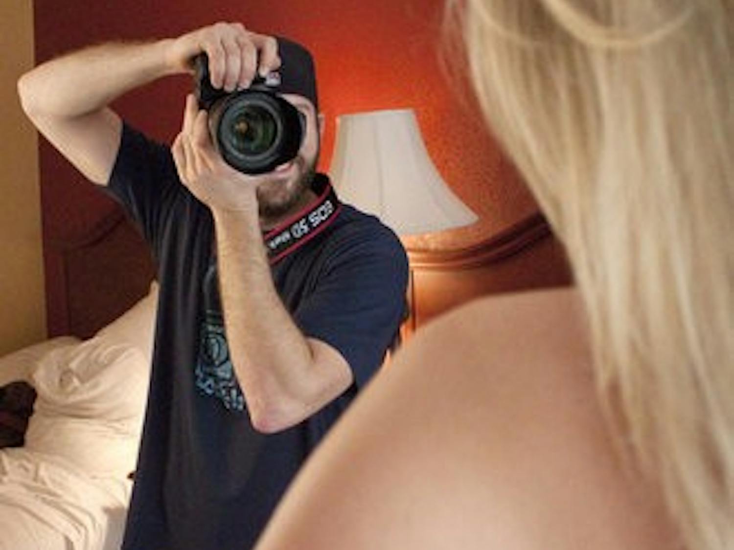 Zachary Johnson, Playboy photographer, shoots an eager coed for "Girls of the SEC." (Emily Adams / Photo Editor)