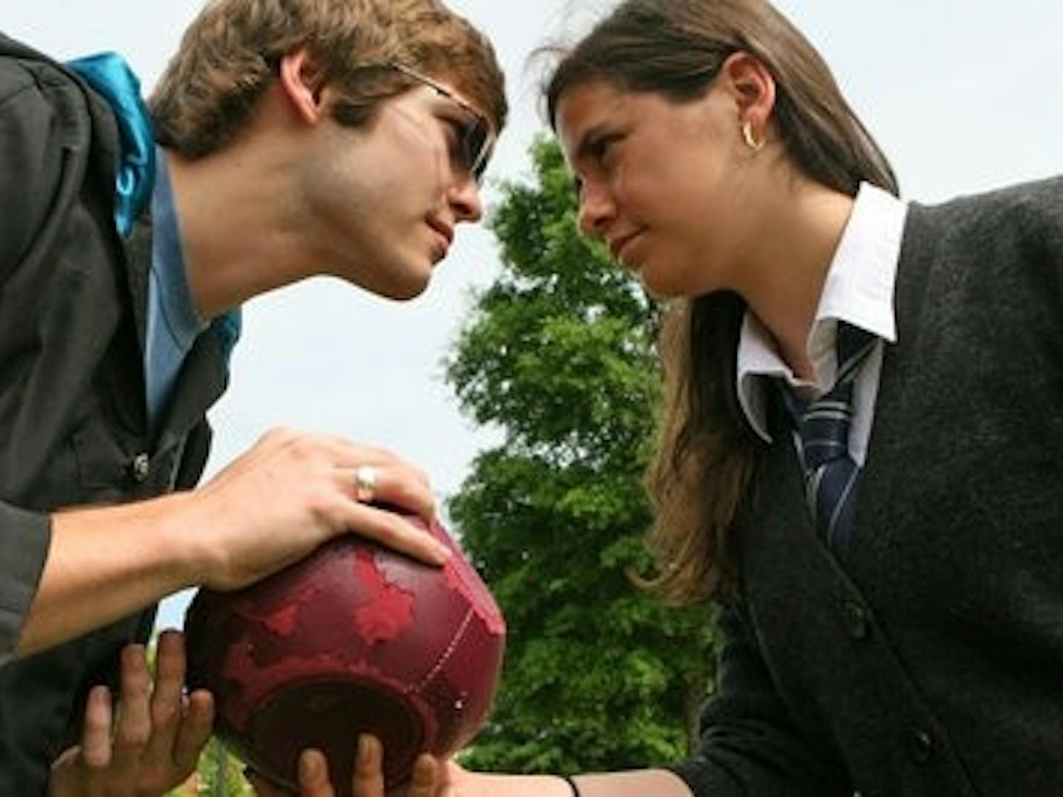 Katie Guthier, right, sophomore in industrial engineering and Spanish, and Michael Lambert, junior in wildlife ecology and management, face off for the quaffle, a ball in play in the mythical sport of quidditch from the Harry Potter series. In the last decade, qudditch has been adapted and played at colleges across the U.S. Engineers Without Borders will be hosting a quidditch tournament April 21 to raise funds for the "Bolivia Project." (Rebecca Croomes / PHOTO EDITOR)