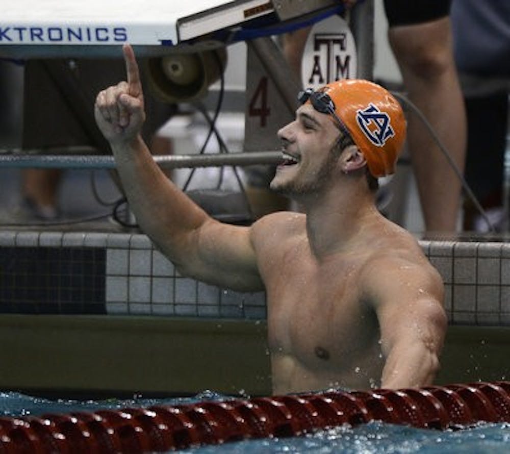 Auburn's Marcelo Chierighini celebrates winning the SEC Championship in the 50-yard freestyle Wednesday, Feb. 20. (Courtesy of Todd Van Emst)