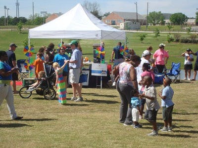Attendees at Tailgate for a Cause sampled tailgate treats from tents at the Tailgate for a Cause competition at Ag Heritage Park. (Amber Franklin / WRITER)