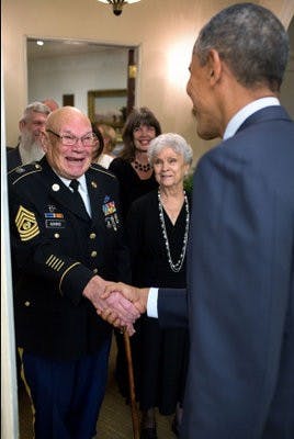 Bennie Adkins shakes hands with President Obama.