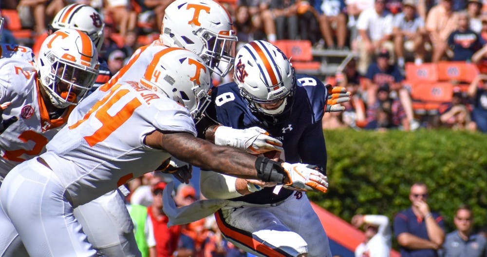 <p>Auburn quarterback Jarrett Stidham (8) is sacked during Auburn football vs. Tennessee on Oct. 13, 2018, in Auburn, Ala.</p>