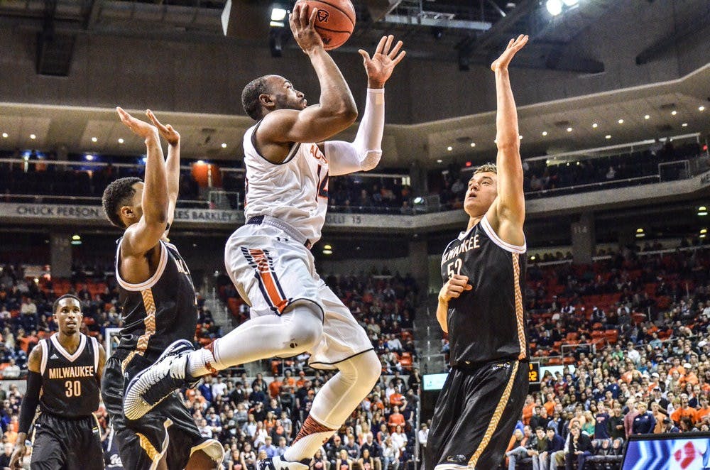 Antoine Mason takes a shot against Milwaukee.

Raye May / PHOTO EDITOR