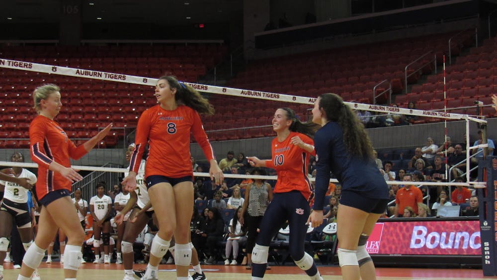 <p>The Auburn Volleyball Team celebrates after scoring a point against Alabama State inside Neville Arena in Auburn, Ala. on August 31, 2022.</p>
