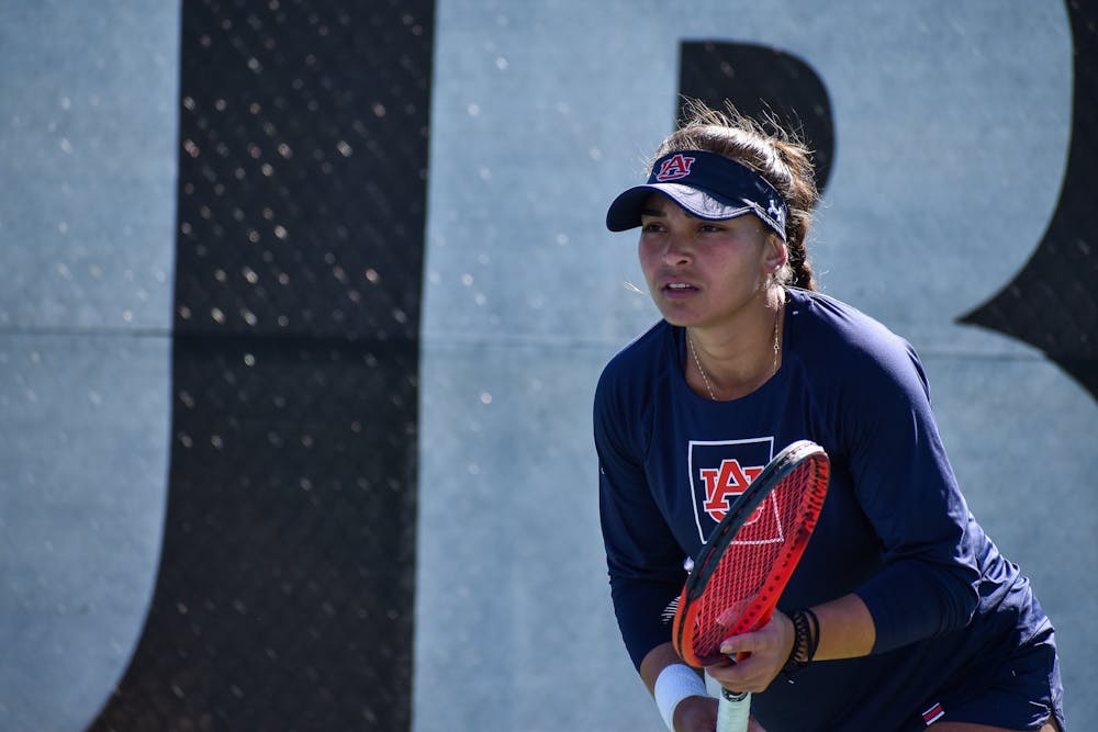 February 6, 2022; Auburn, Alabama; Selin Ovunc prepares for a serve in a match between Auburn and Clemson at the Yarbrough Tennis Center.