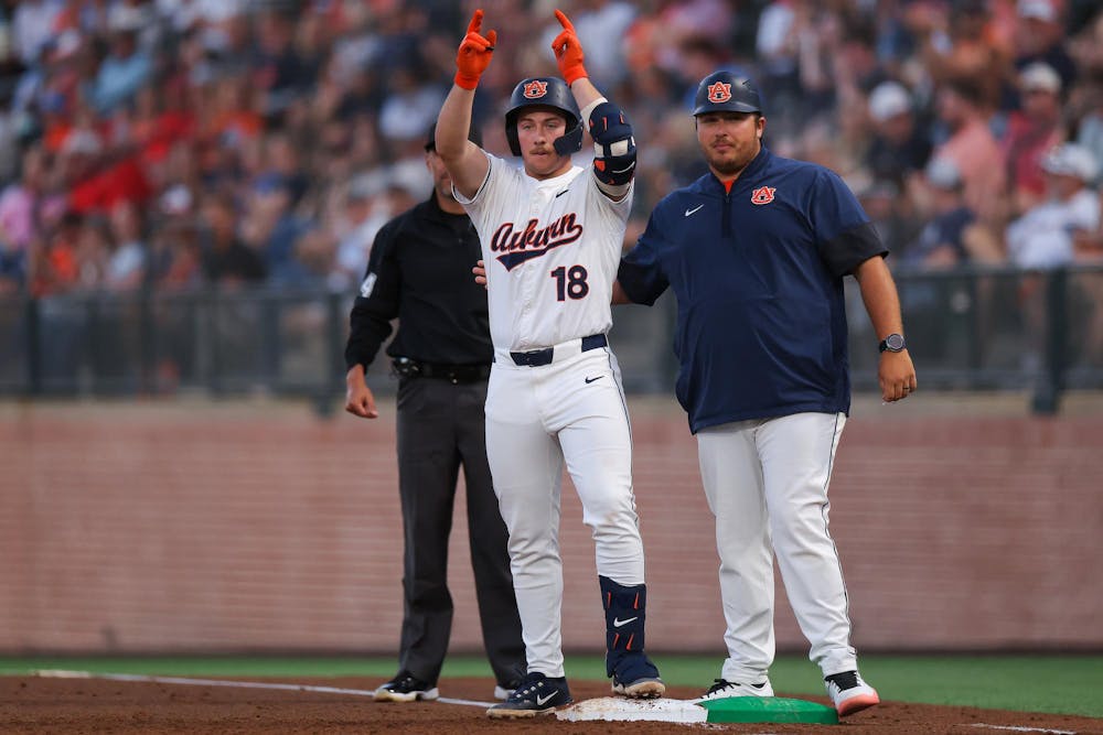 <p>AUBURN, AL - MAY 15 - Auburn's Ethin Bingaman (18), Auburn Student Assistant Coach Sonny DiChiara - (4) Auburn Tigers vs. (5) Georgia Bulldogs at Plainsman Park in Auburn, AL on Friday, May 15, 2026. Photo by Zach Bland/Auburn Tigers</p>