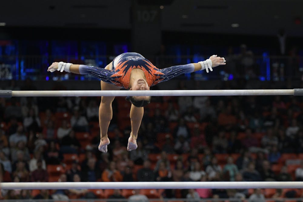 <p>Cassie Stevens on bars at Quad Meet in Neville Arena on February 2nd 2024</p>