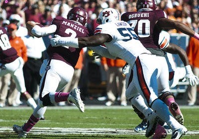 Defensive end Carl Lawson sacks Johnny Manziel in Auburn's upset win against Texas A&M last season.