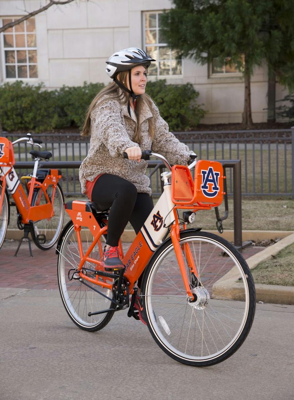 <p>Auburn University student Caitlin Miley tries one of the new War Eagle Bike Share bicycles.</p>