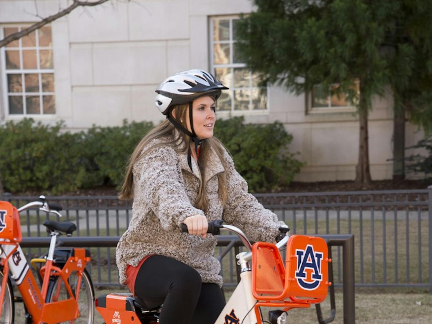 Auburn University student Caitlin Miley tries one of the new War Eagle Bike Share bicycles.
