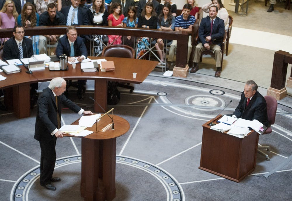 Embattled Alabama Chief Justice Roy Moore answers questions from attorney John Carroll during Moore's ethics trial at the Alabama Judicial Building in Montgomery, Ala., on Wednesday September 28, 2016.