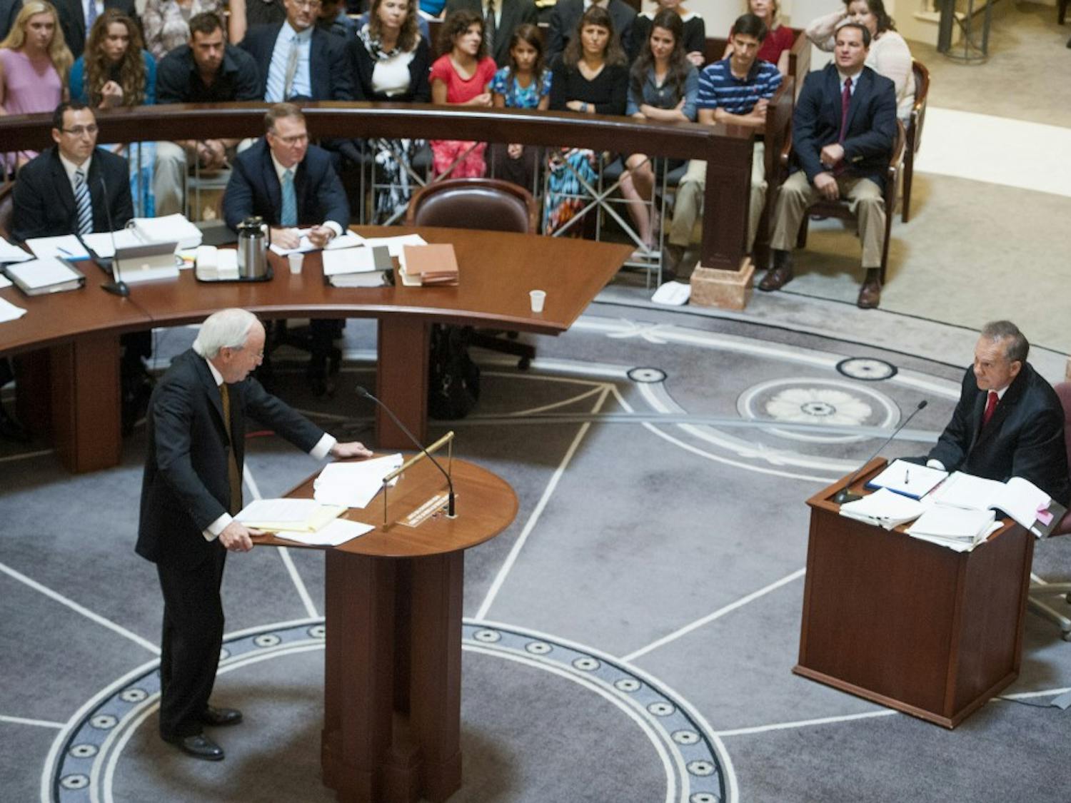 Embattled Alabama Chief Justice Roy Moore answers questions from attorney John Carroll during Moore's ethics trial at the Alabama Judicial Building in Montgomery, Ala., on Wednesday September 28, 2016.