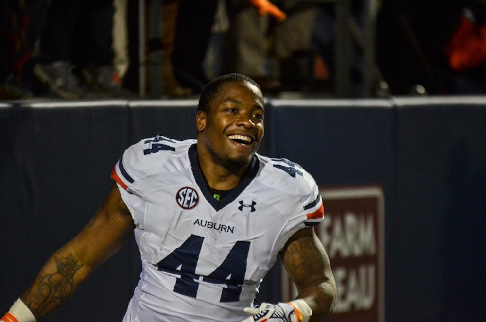Cameron Artis-Payne celebrates after the road win over Ole Miss on November 1. (File photo)